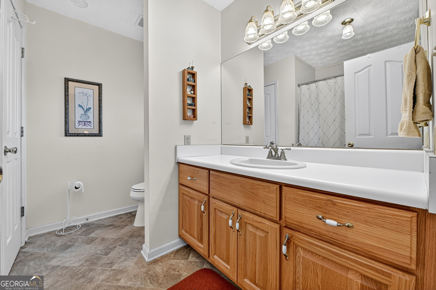 122 D D J Lane Ellijay, GA 30540 - Photo 36 of 51 a bathroom with a sink a vanity and a mirror