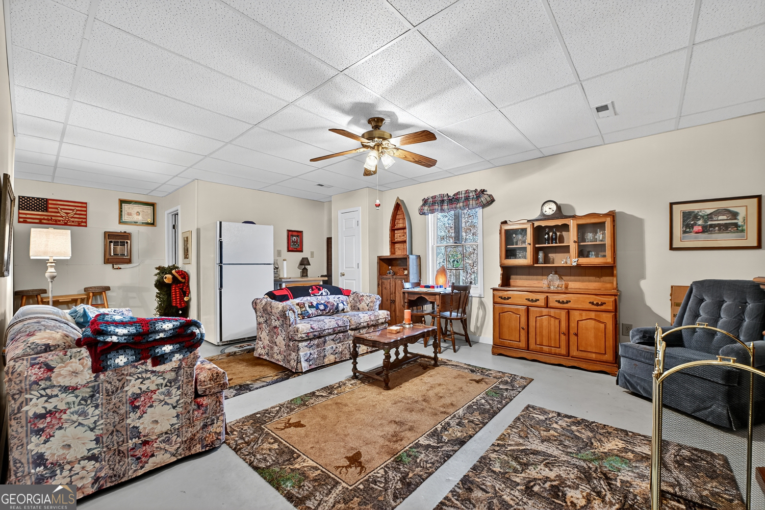 122 D D J Lane Ellijay, GA 30540 - Photo 40 of 51 a living room with furniture and a flat screen tv