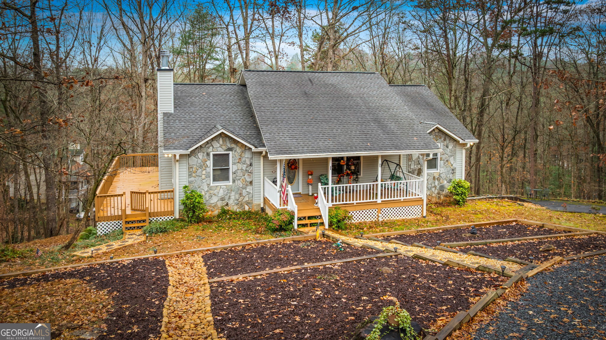 122 D D J Lane Ellijay, GA 30540 - Photo 4 of 51 a front view of a house with a yard