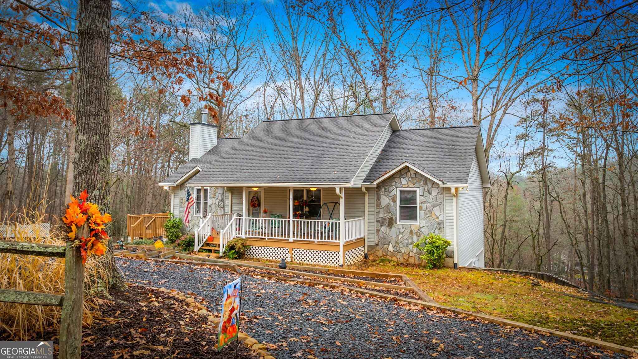 122 D D J Lane Ellijay, GA 30540 - Photo 5 of 51 a front view of a house with a yard and large tree