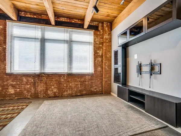 a view of a brick house with windows