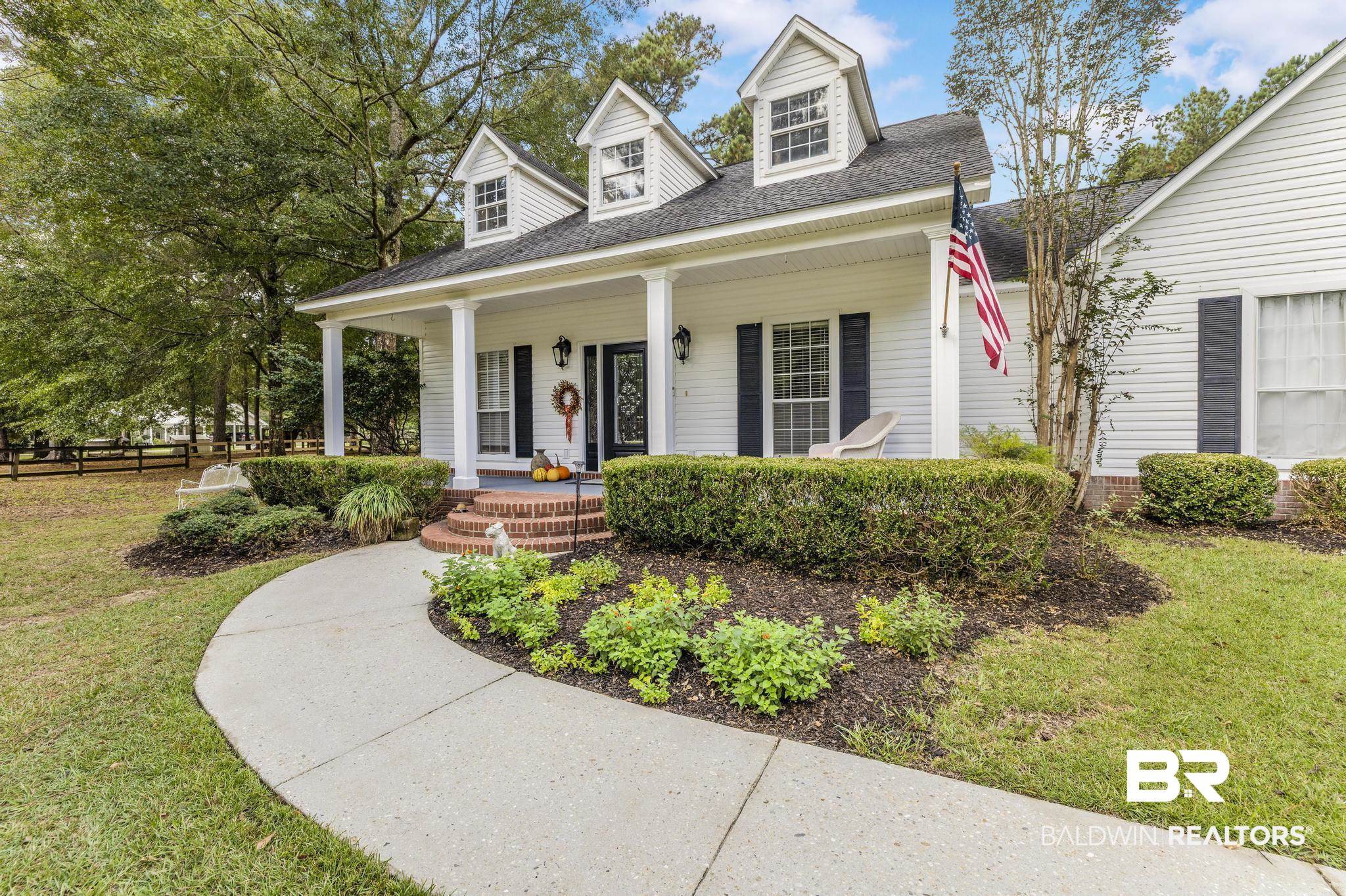 10603 Old Stage Road Stockton, AL 36579 - Photo 7 of 34 Cape cod-style house with a porch and roof with shingles