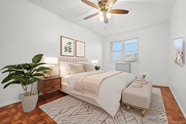 a bedroom with a bed and a potted plant