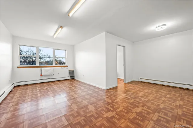 a view of an empty room with a window