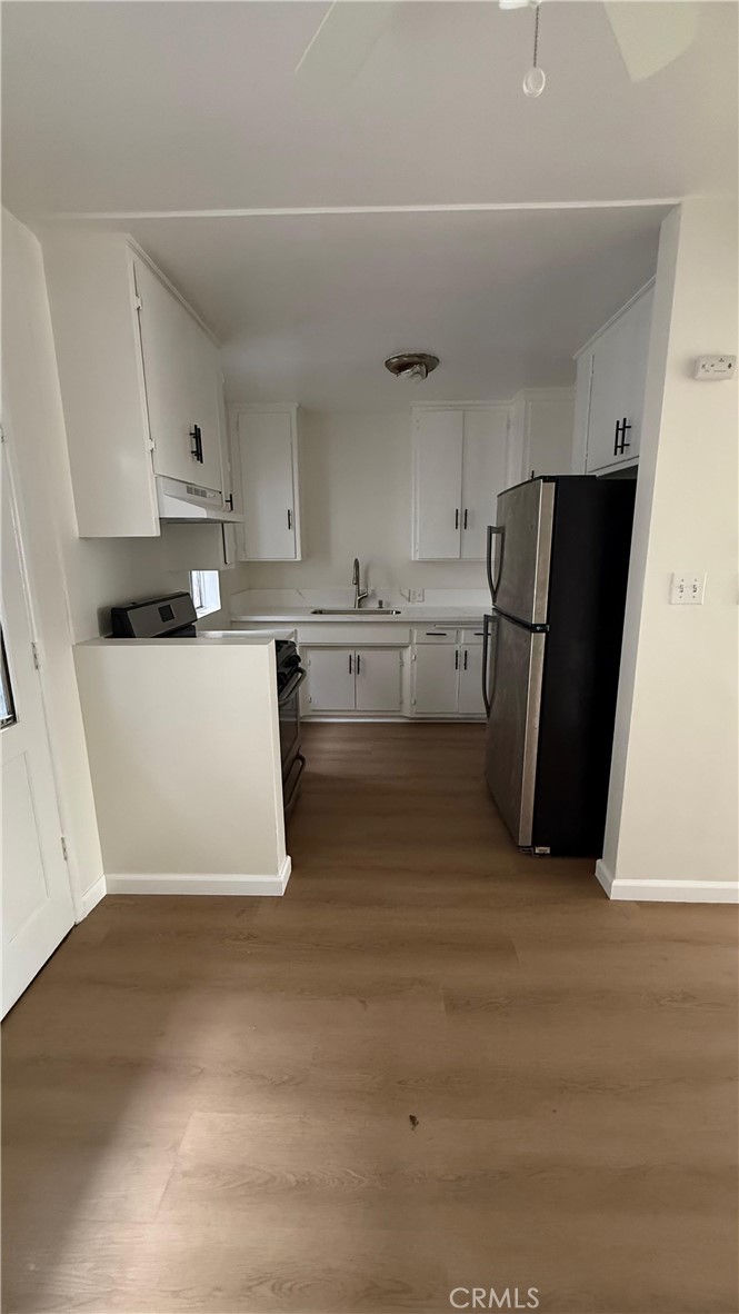 1345 Anaheim Street, Unit 2 Harbor City, CA 90710 - Photo 16 of 16 a kitchen with stainless steel appliances a refrigerator and a stove