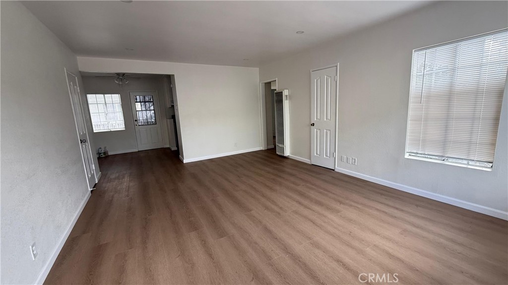 1345 Anaheim Street, Unit 2 Harbor City, CA 90710 - Photo 7 of 16 wooden floor in an empty room with a window