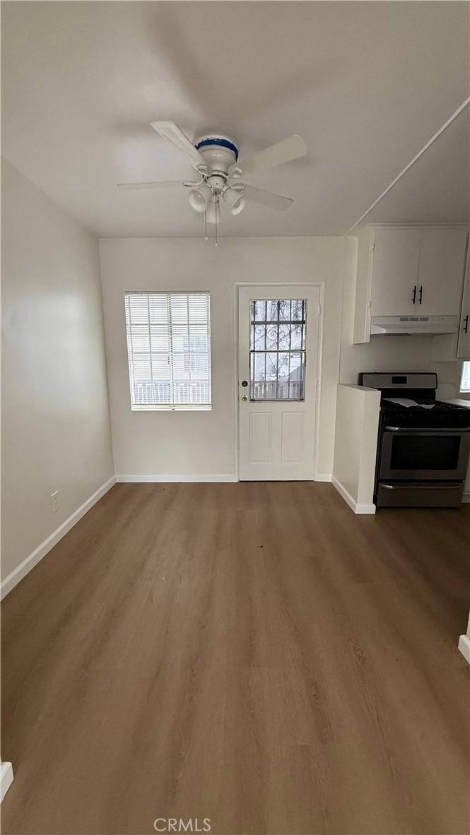 1345 Anaheim Street, Unit 2 Harbor City, CA 90710 - Photo 10 of 16 a view of empty room with wooden floor and window