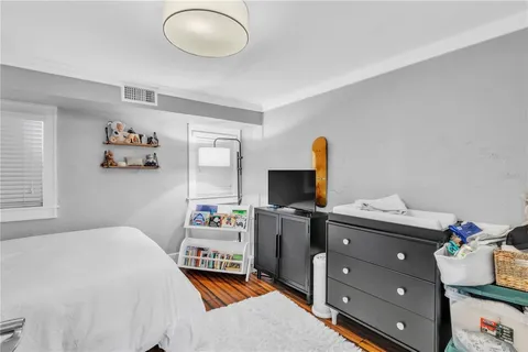 a bedroom with a workspace