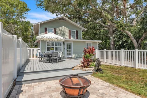 a house view with a seating space and garden
