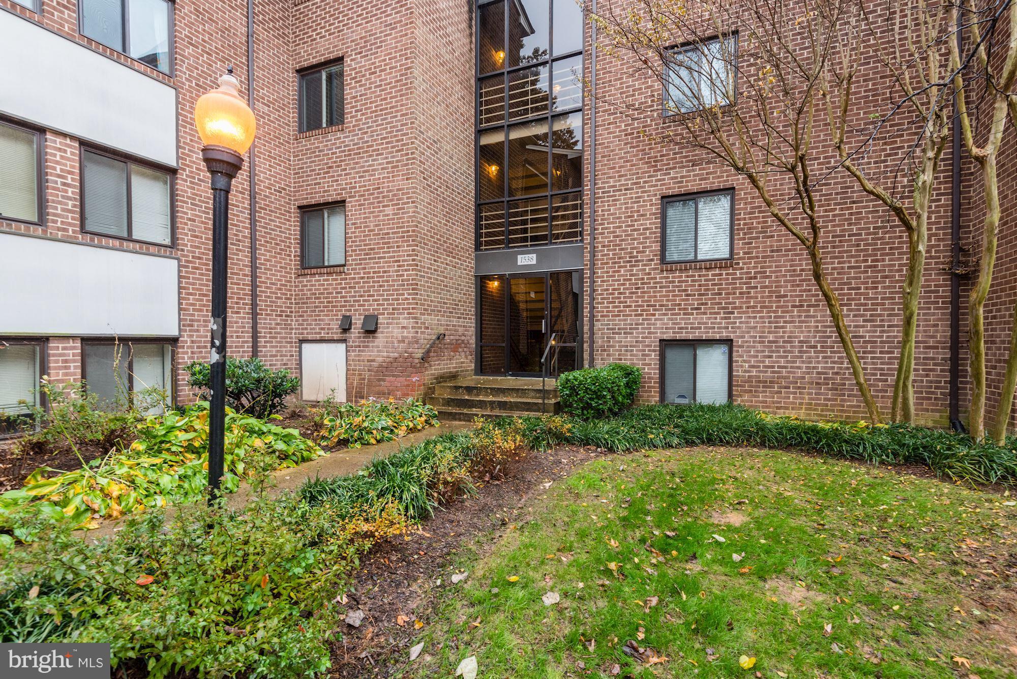 1538 Northgate Square, Unit 1A Reston, VA 20190 - Photo 18 of 18 a front view of a house with garden