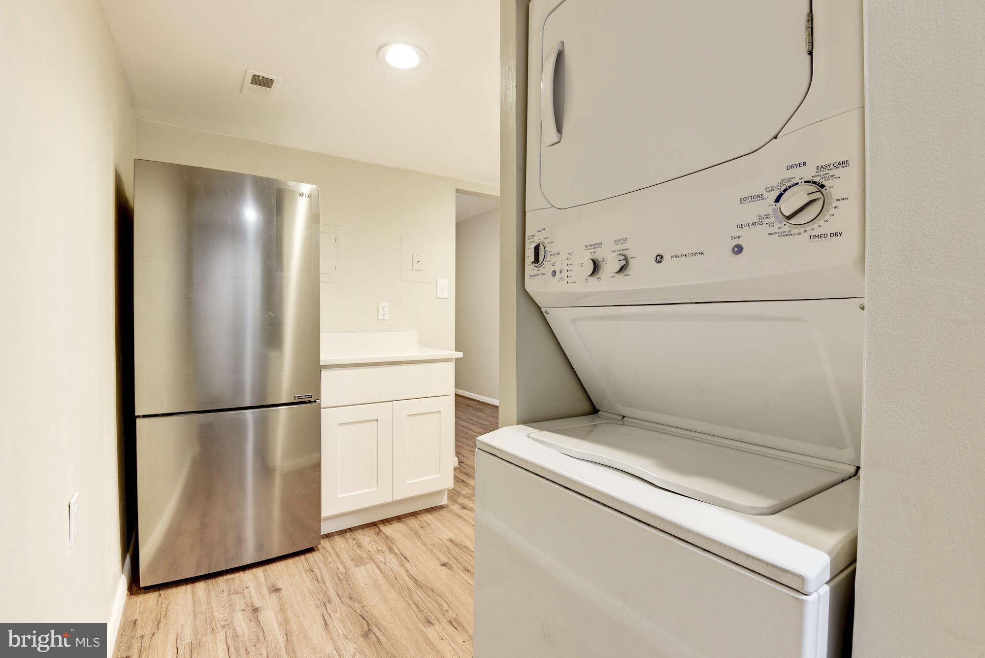 1538 Northgate Square, Unit 1A Reston, VA 20190 - Photo 4 of 18 a utility room with dryer and washer