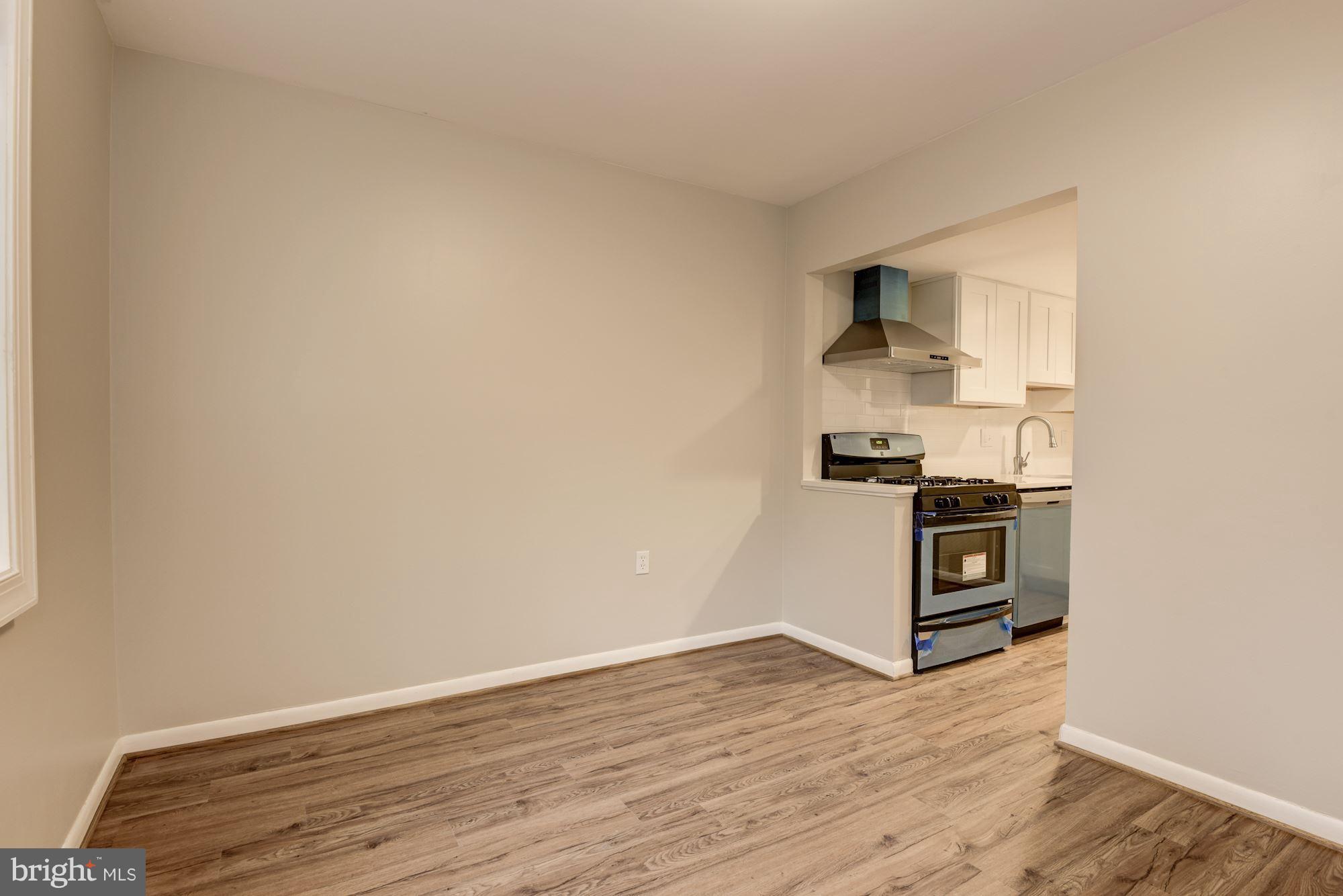 1538 Northgate Square, Unit 1A Reston, VA 20190 - Photo 6 of 18 a view of a kitchen with wooden floor and cabinets