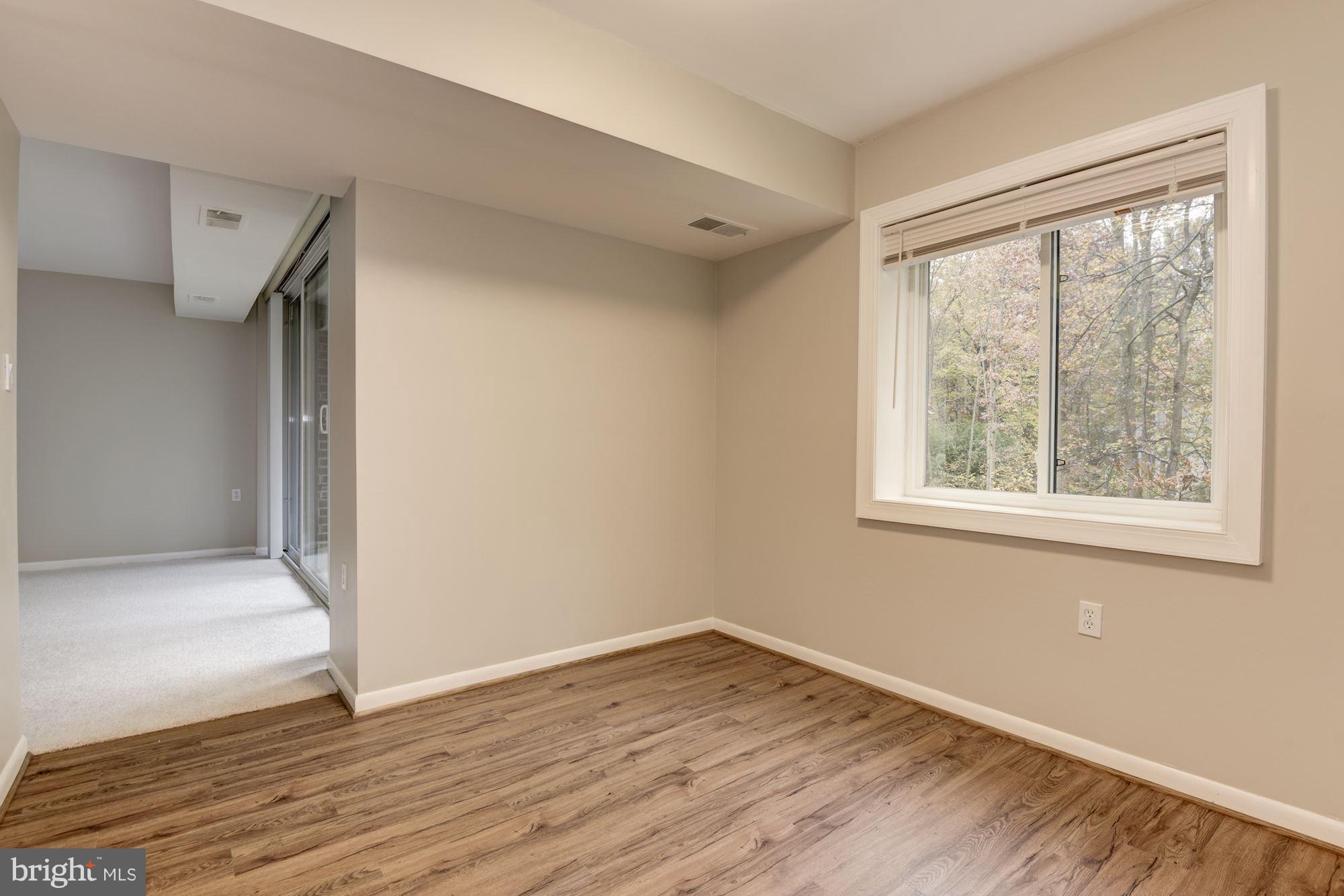 1538 Northgate Square, Unit 1A Reston, VA 20190 - Photo 8 of 18 a view of empty room with wooden floor and fan