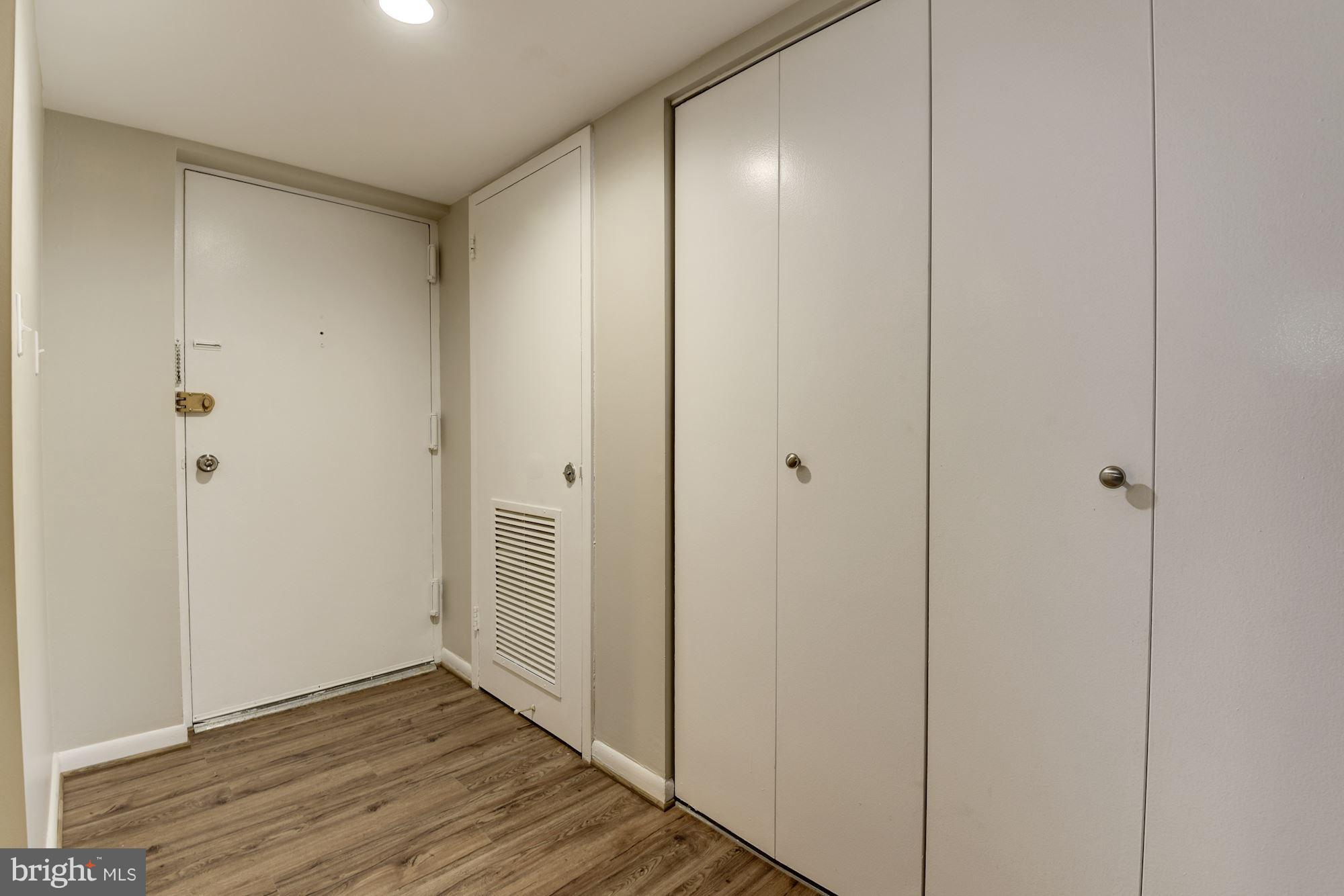 1538 Northgate Square, Unit 1A Reston, VA 20190 - Photo 9 of 18 a view of an empty room with wooden floor