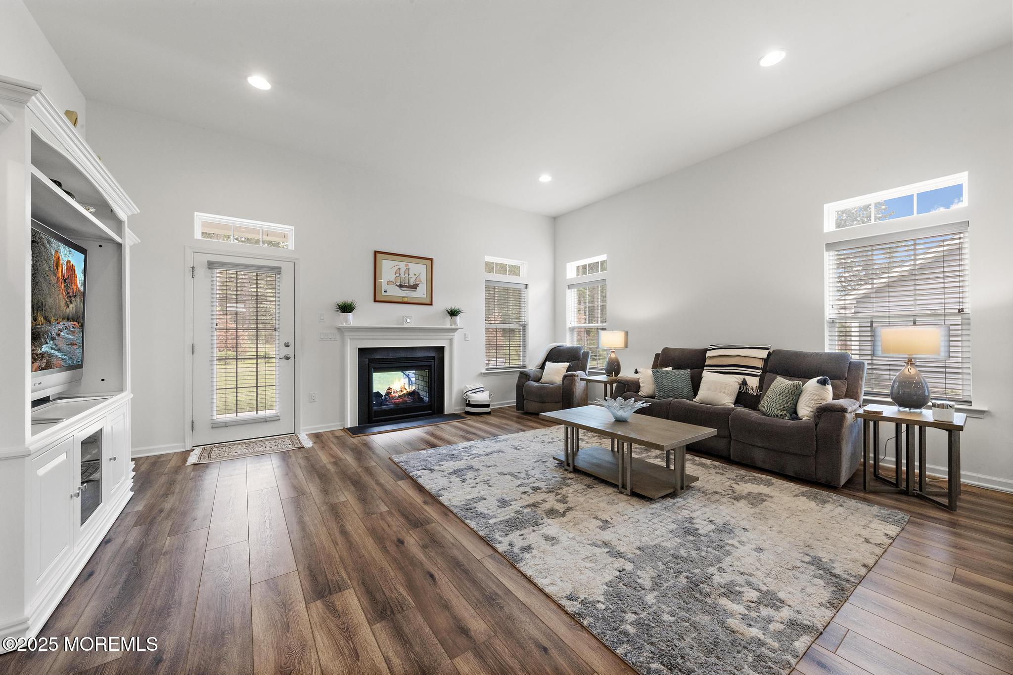 21 Aurora Circle Barnegat, NJ 08005 - Photo 12 of 79 a living room with furniture and a fireplace