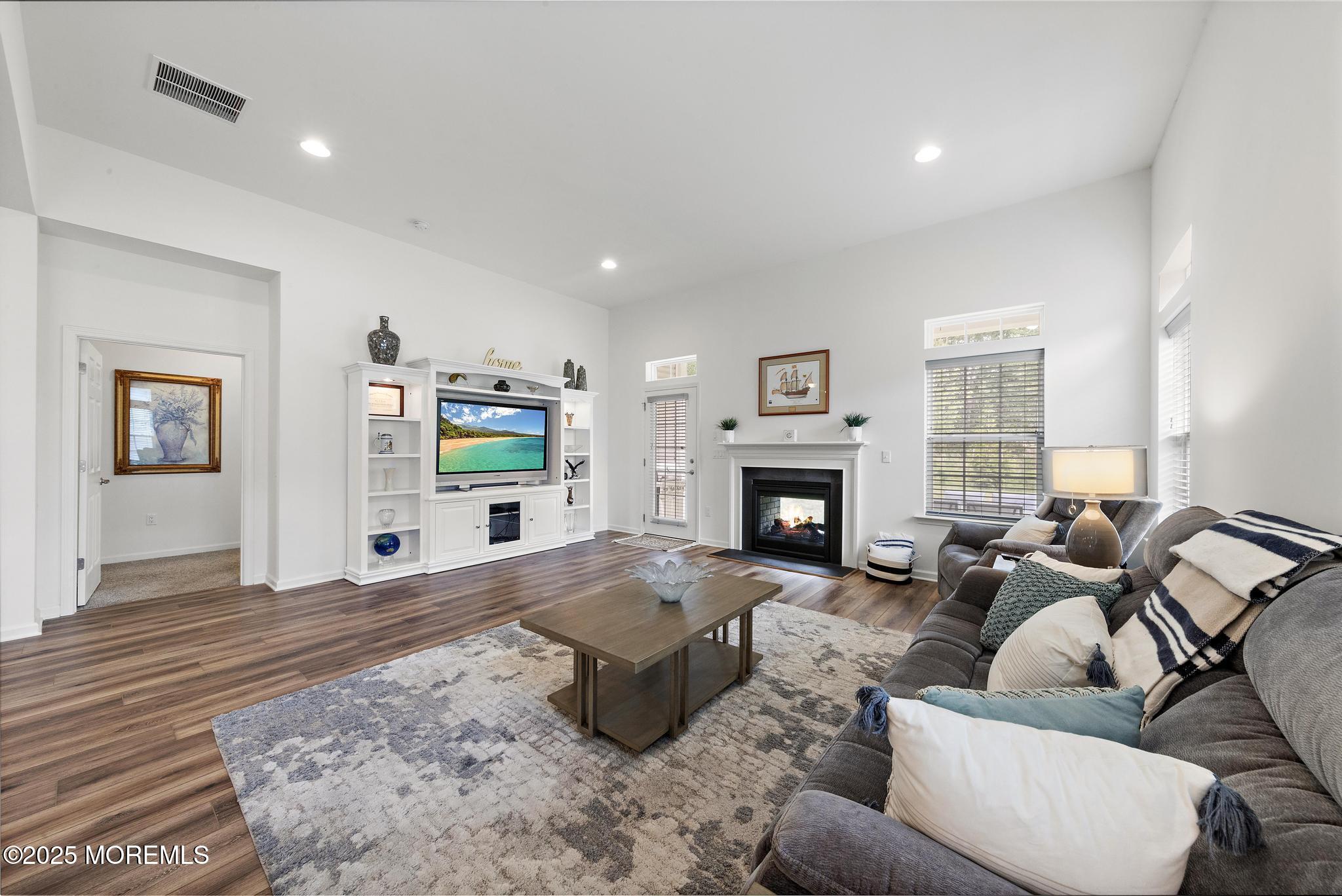 21 Aurora Circle Barnegat, NJ 08005 - Photo 15 of 79 a living room with furniture and a fireplace