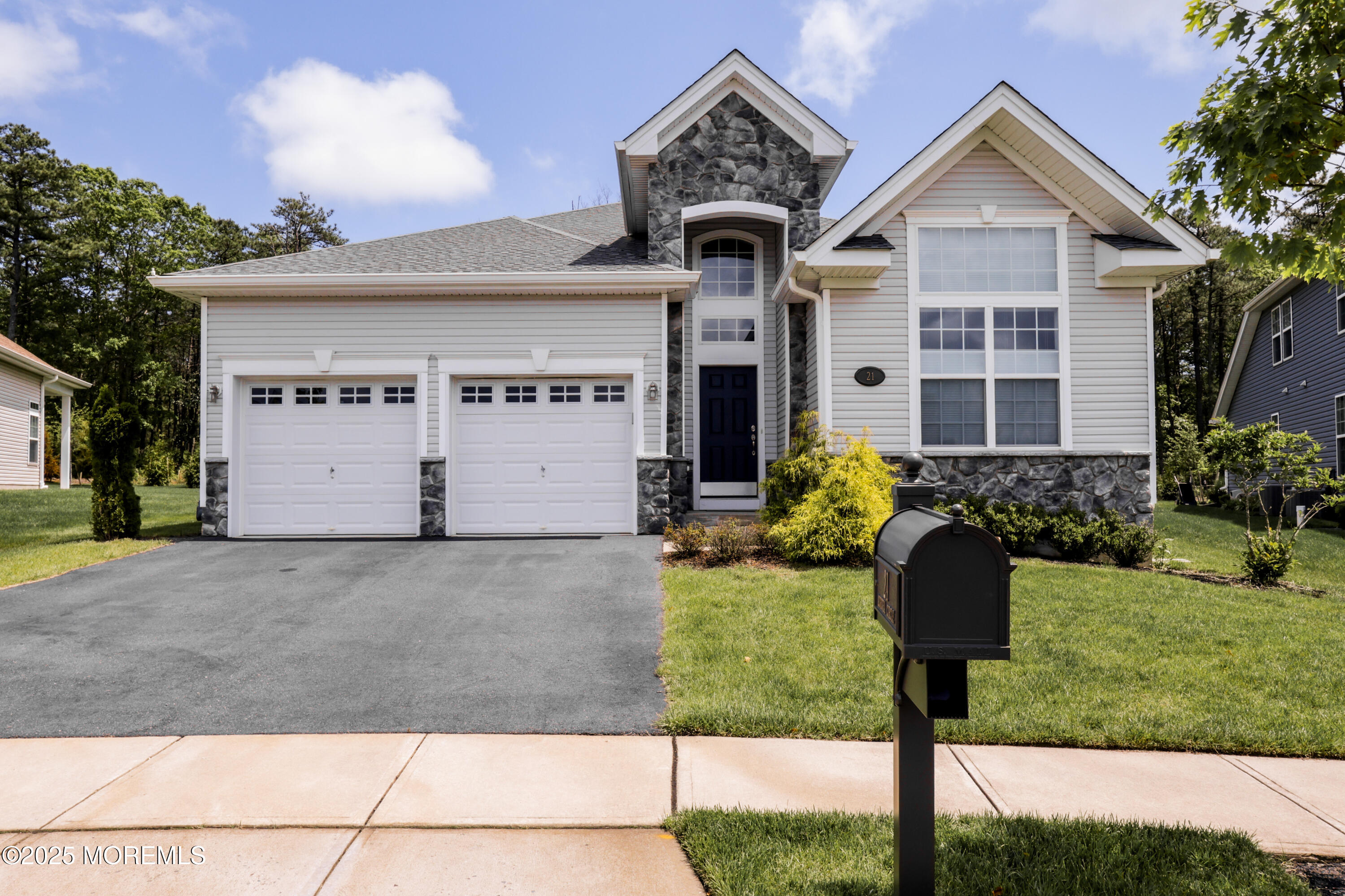 21 Aurora Circle Barnegat, NJ 08005 - Photo 2 of 79 a front view of a house with garden