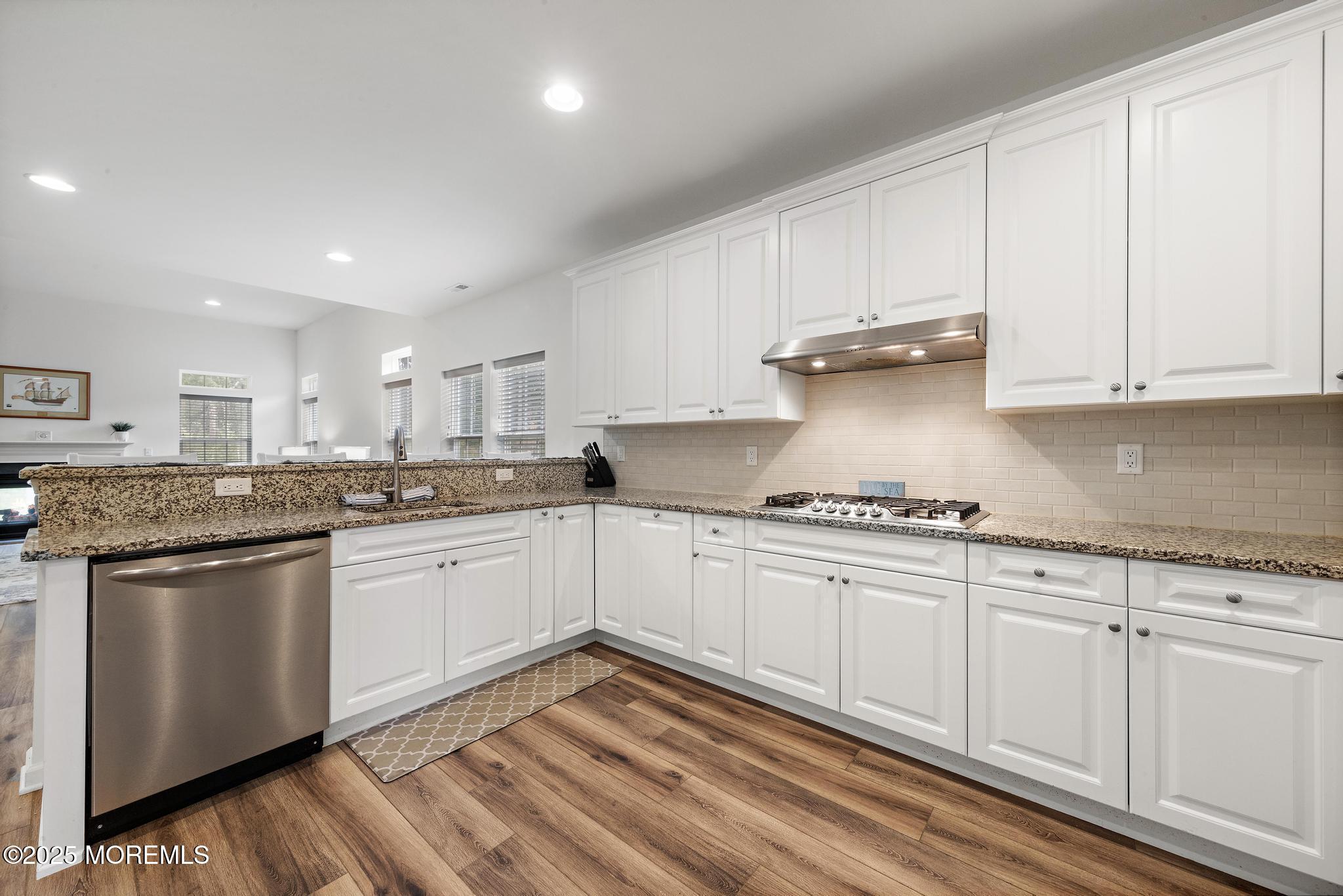21 Aurora Circle Barnegat, NJ 08005 - Photo 30 of 79 a kitchen with granite countertop white cabinets and stainless steel appliances