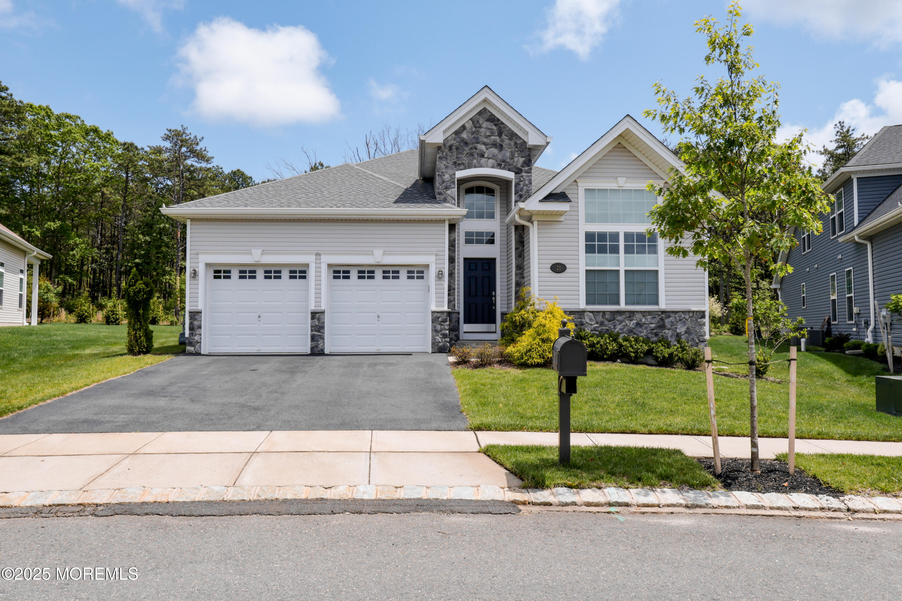 21 Aurora Circle Barnegat, NJ 08005 - Photo 3 of 79 a front view of a house with a garden