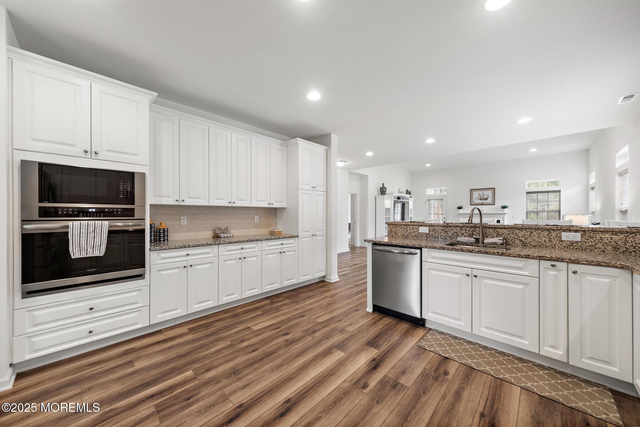 21 Aurora Circle Barnegat, NJ 08005 - Photo 31 of 79 a kitchen with stainless steel appliances granite countertop a stove a sink and a microwave