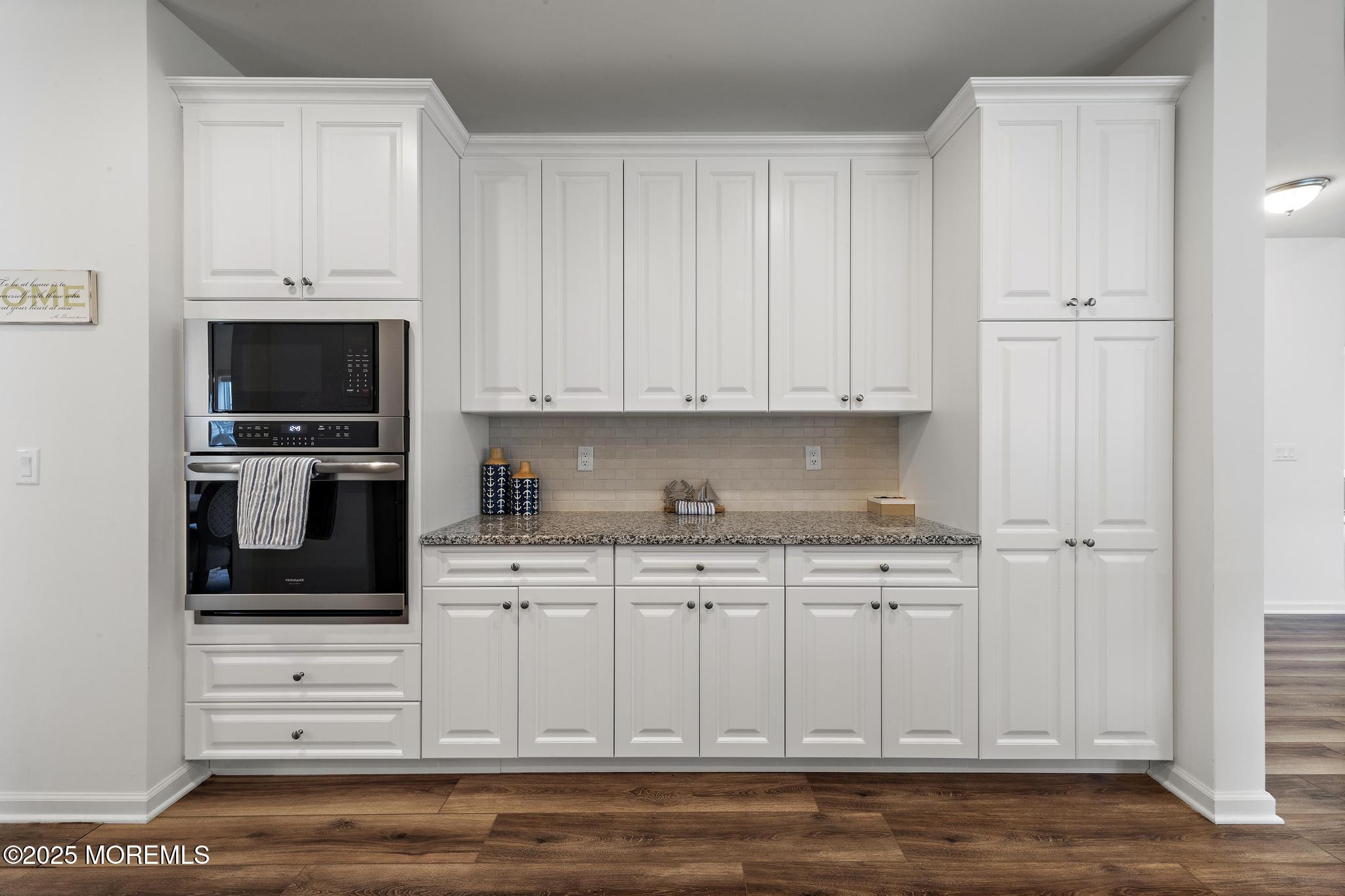 21 Aurora Circle Barnegat, NJ 08005 - Photo 32 of 79 a kitchen with stainless steel appliances granite countertop a refrigerator and white cabinets