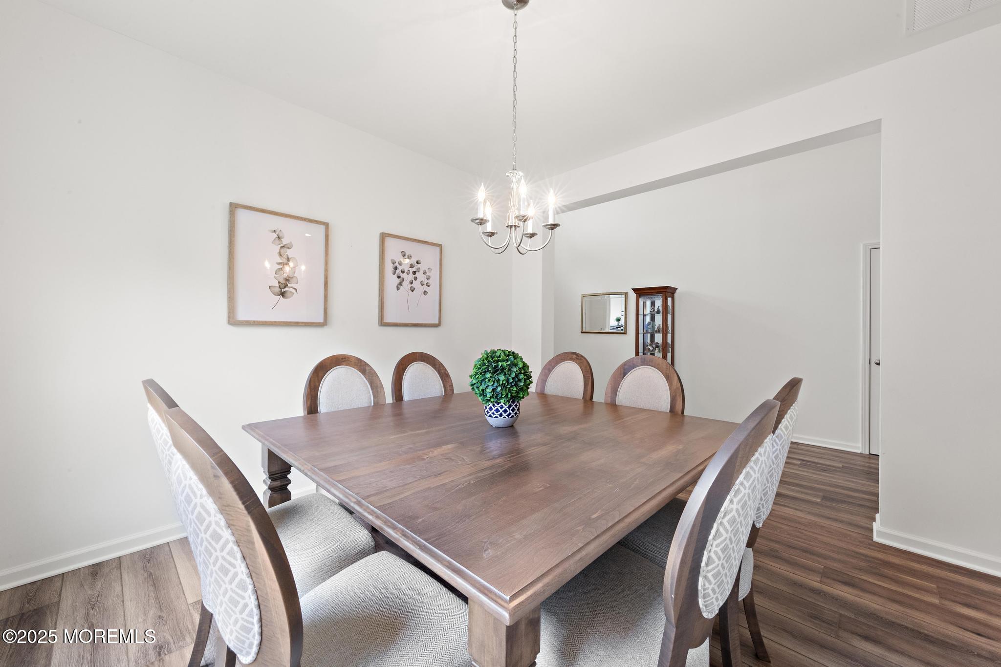 21 Aurora Circle Barnegat, NJ 08005 - Photo 36 of 79 a view of a dining room a chandelier and wooden floor