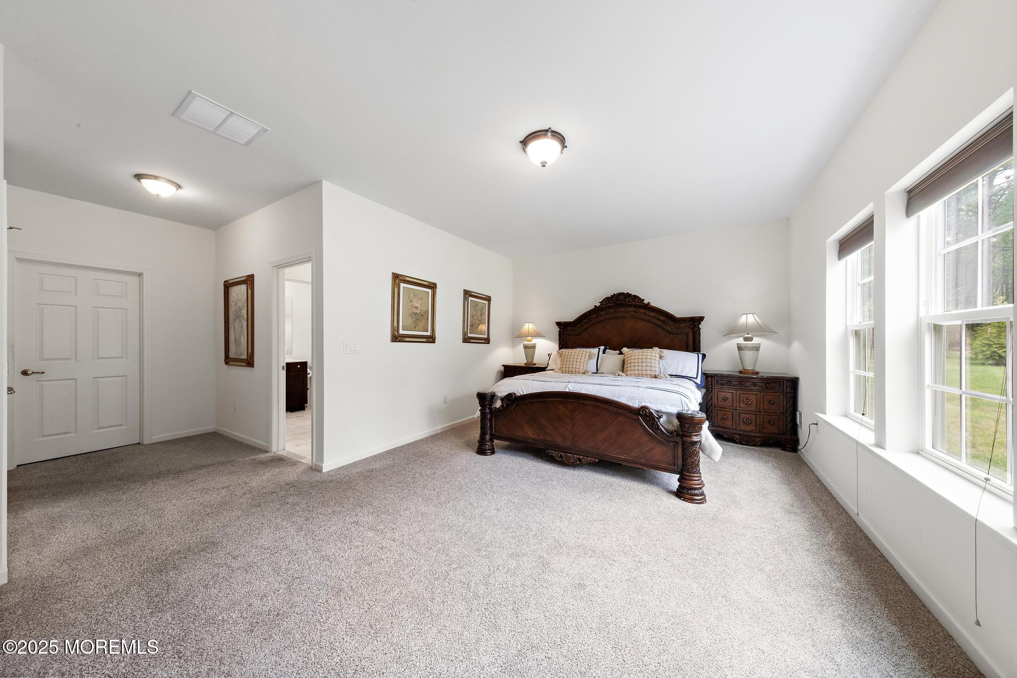 21 Aurora Circle Barnegat, NJ 08005 - Photo 44 of 79 a bedroom with a bed painted wall next to a window