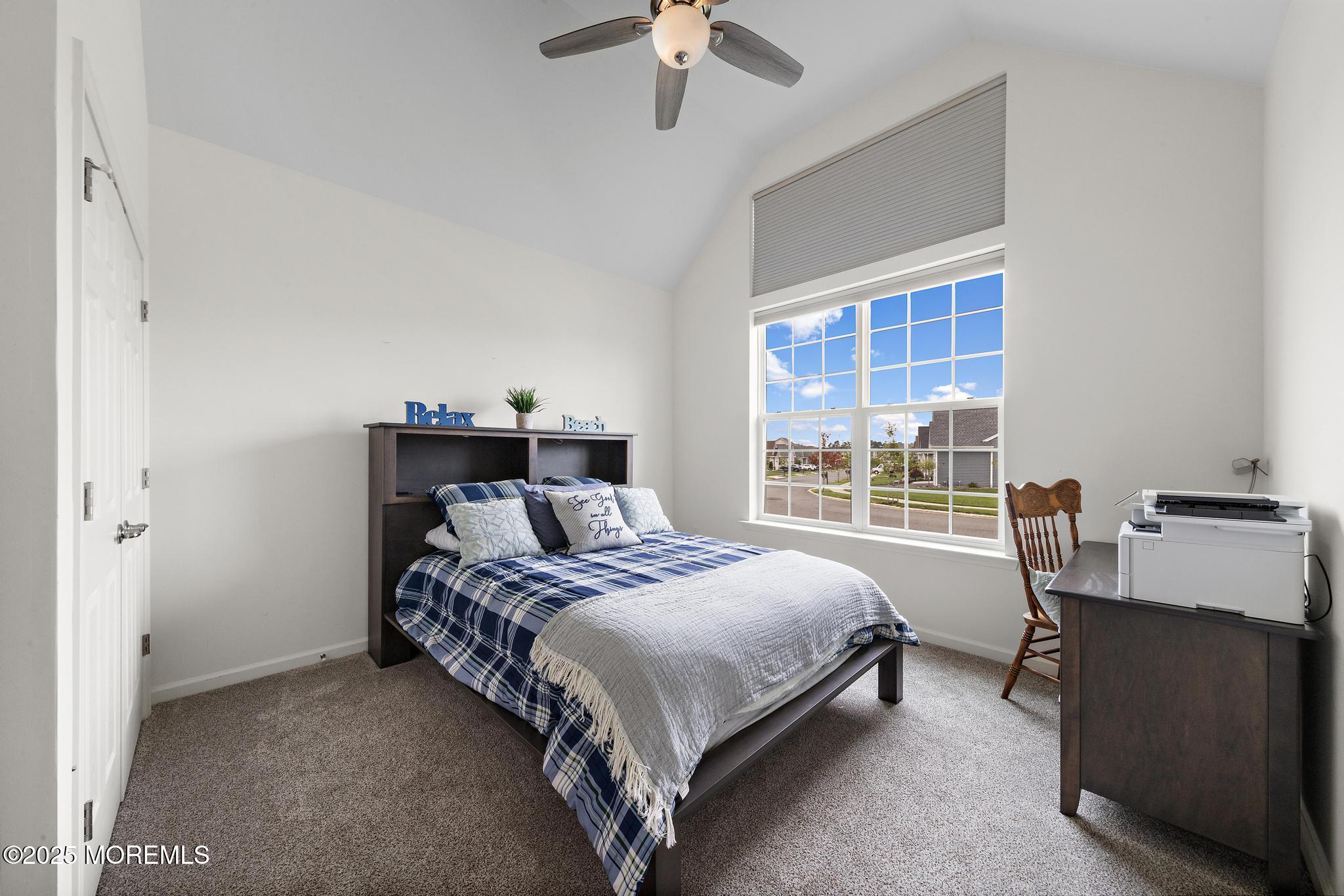 21 Aurora Circle Barnegat, NJ 08005 - Photo 52 of 79 a bedroom with a bed and a chandelier