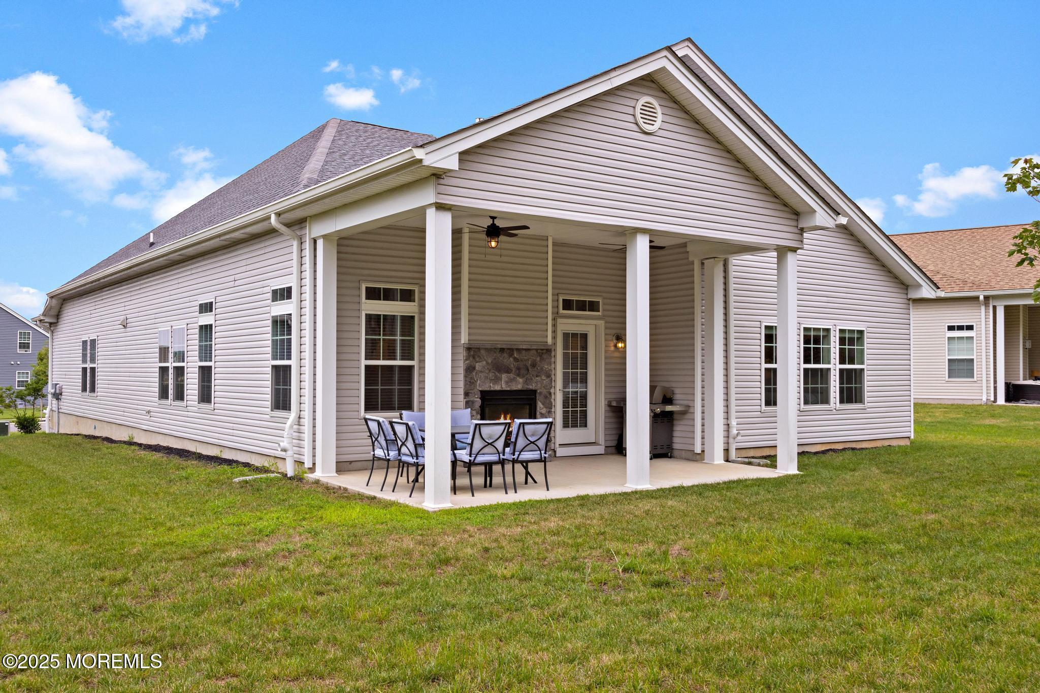 21 Aurora Circle Barnegat, NJ 08005 - Photo 55 of 79 a front view of house with yard and outdoor seating