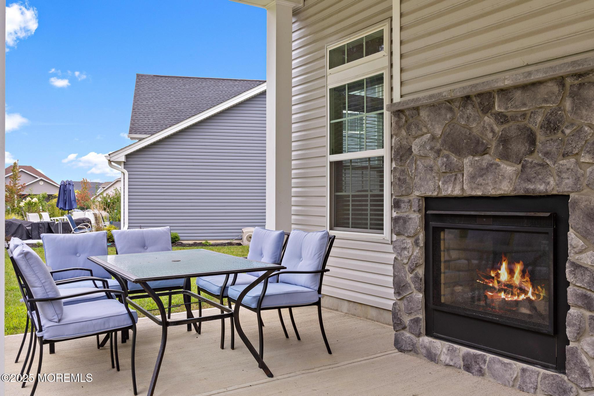21 Aurora Circle Barnegat, NJ 08005 - Photo 57 of 79 a patio with a table and chairs and a barbeque
