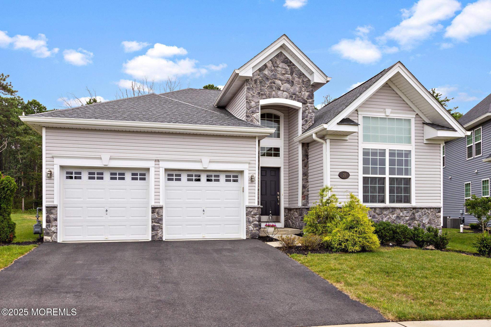 21 Aurora Circle Barnegat, NJ 08005 - Photo 6 of 79 a front view of a house with a yard