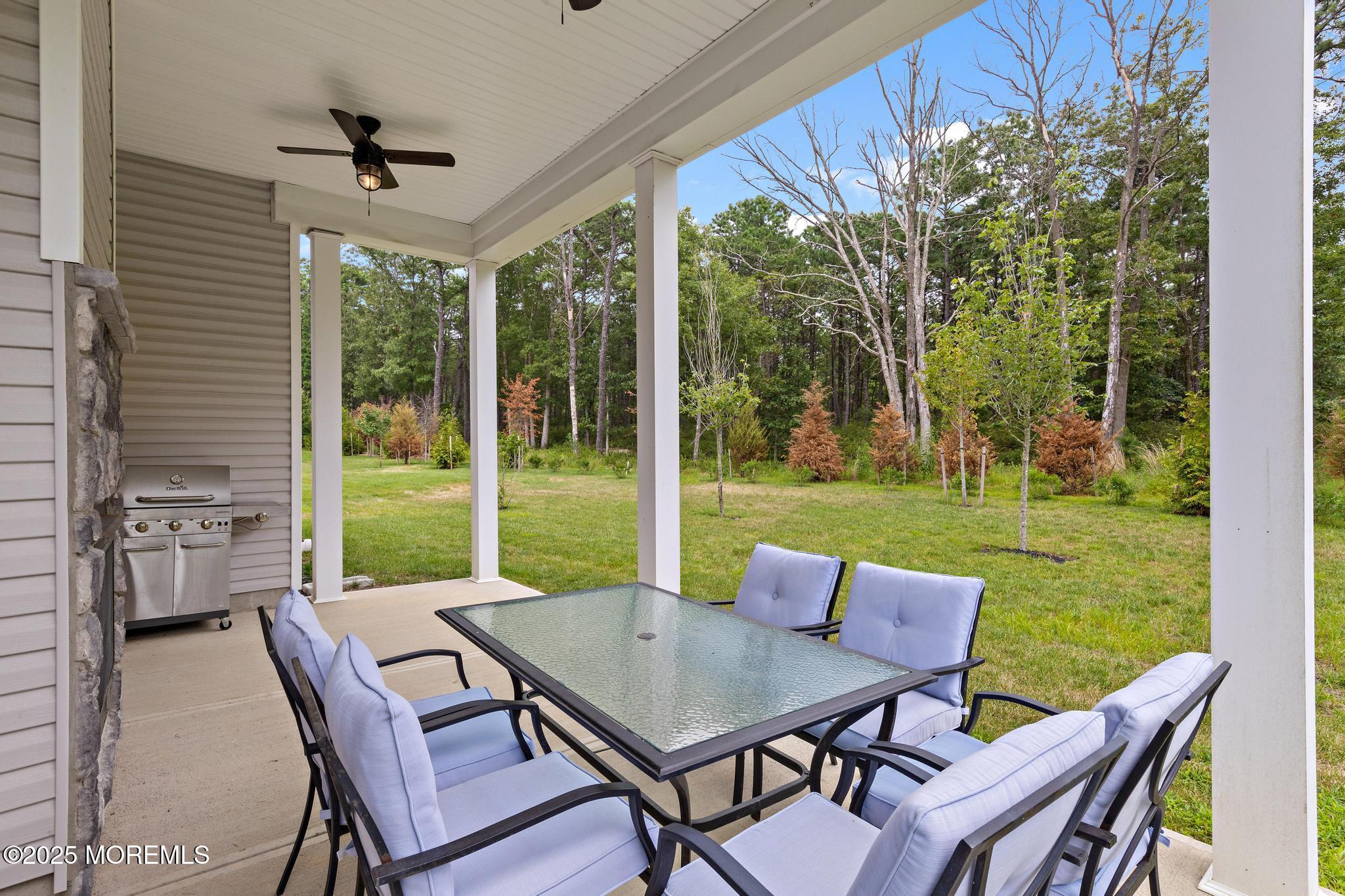 21 Aurora Circle Barnegat, NJ 08005 - Photo 63 of 79 a view of a patio with a table chairs and a backyard