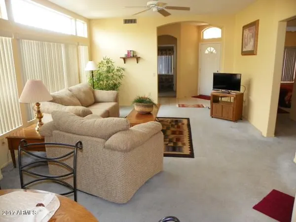 a kitchen with a refrigerator sink and cabinets