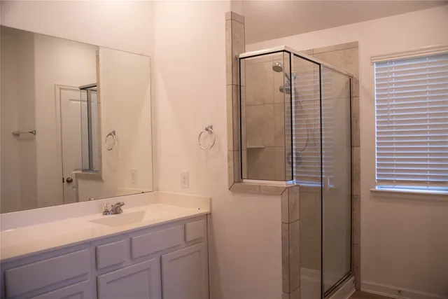 an aerial view of a house with a garden and lake view