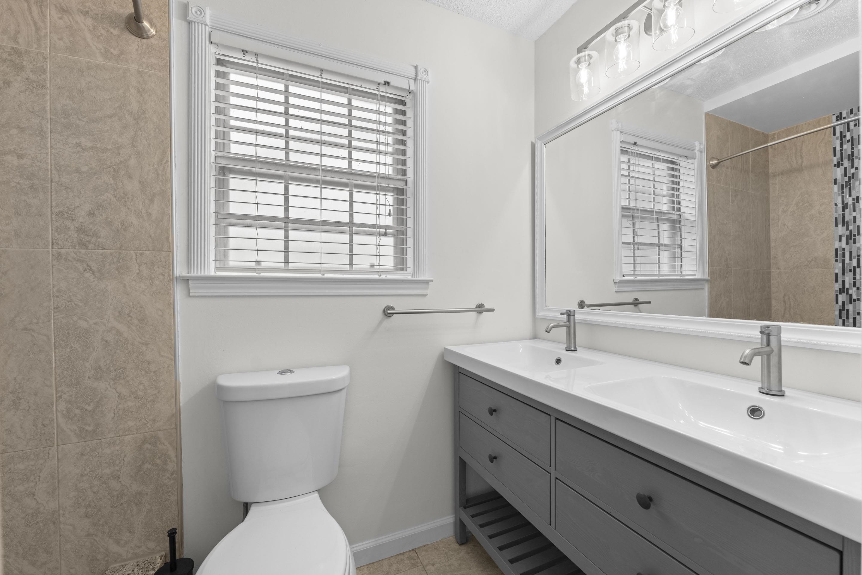 499 Duscoe Street Collierville, TN 38017 - Photo 9 of 38 a bathroom with a toilet sink and mirror