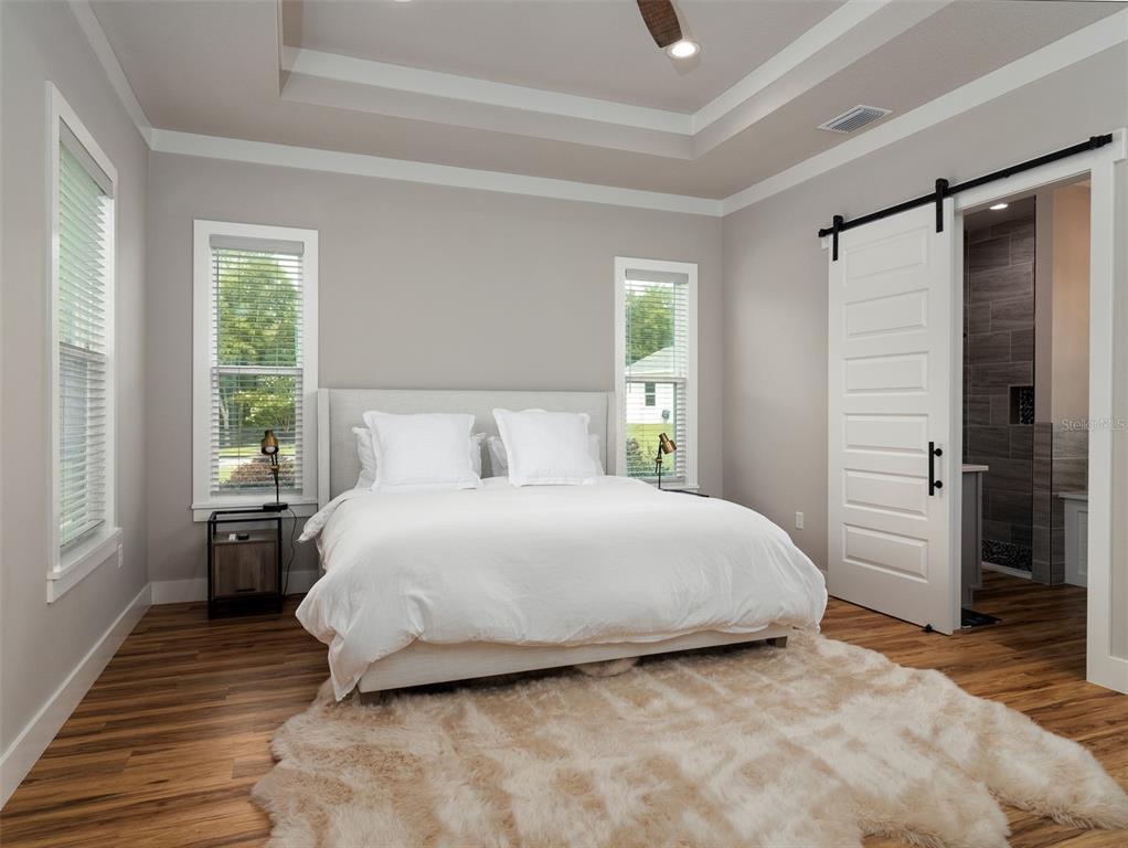 4988 Northwest 101st St Road Ocala, FL 34482 - Photo 11 of 30 a bedroom with a bed and a window