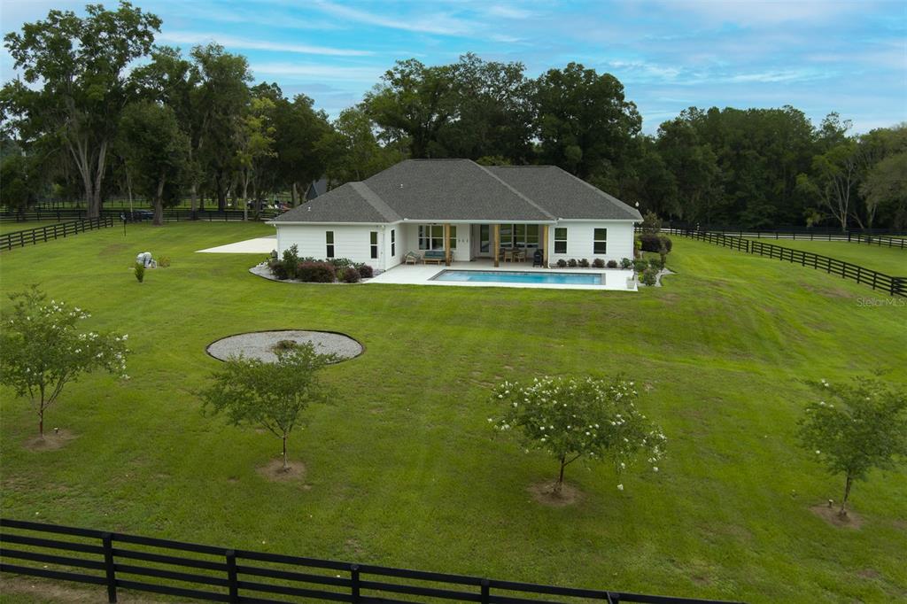 4988 Northwest 101st St Road Ocala, FL 34482 - Photo 22 of 30 a front view of a house with garden