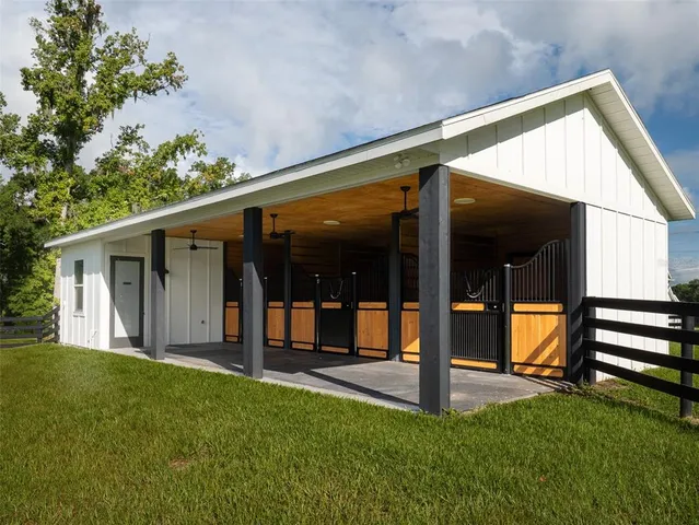 a view of a house with backyard and porch