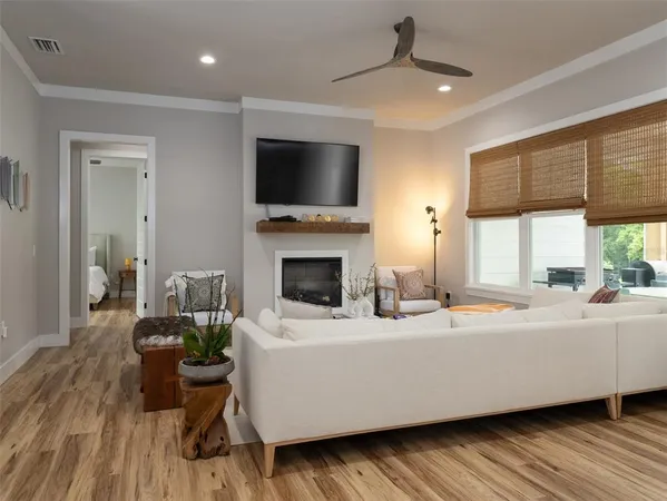 a living room with furniture fireplace and flat screen tv