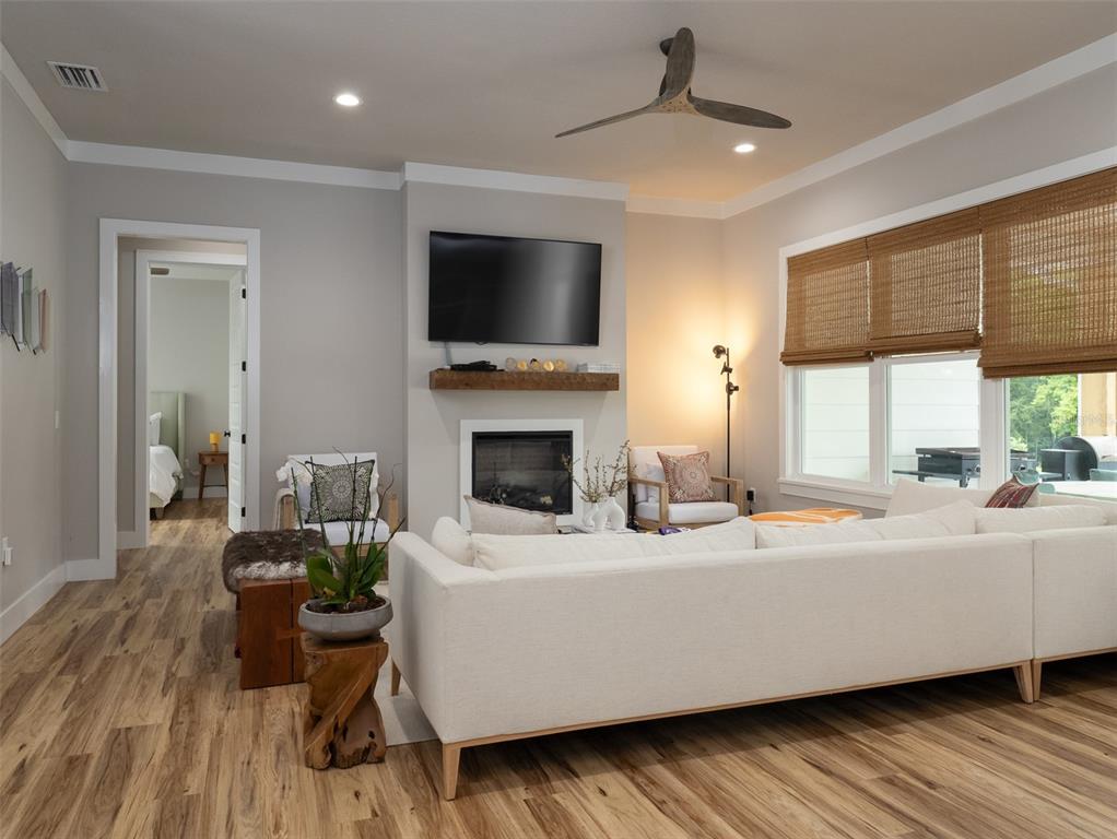 4988 Northwest 101st St Road Ocala, FL 34482 - Photo 5 of 30 a living room with furniture fireplace and flat screen tv