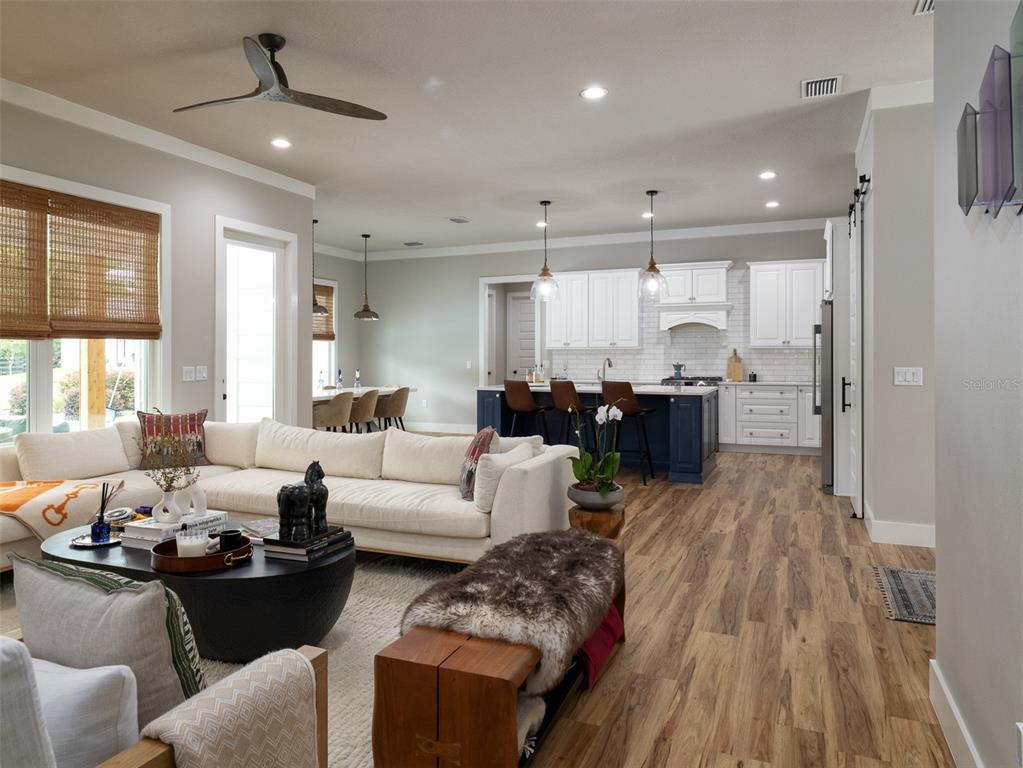 4988 Northwest 101st St Road Ocala, FL 34482 - Photo 6 of 30 a living room with furniture and a wooden floor