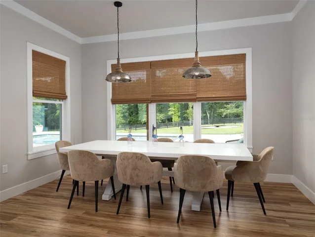 a dining room with furniture window wooden floor