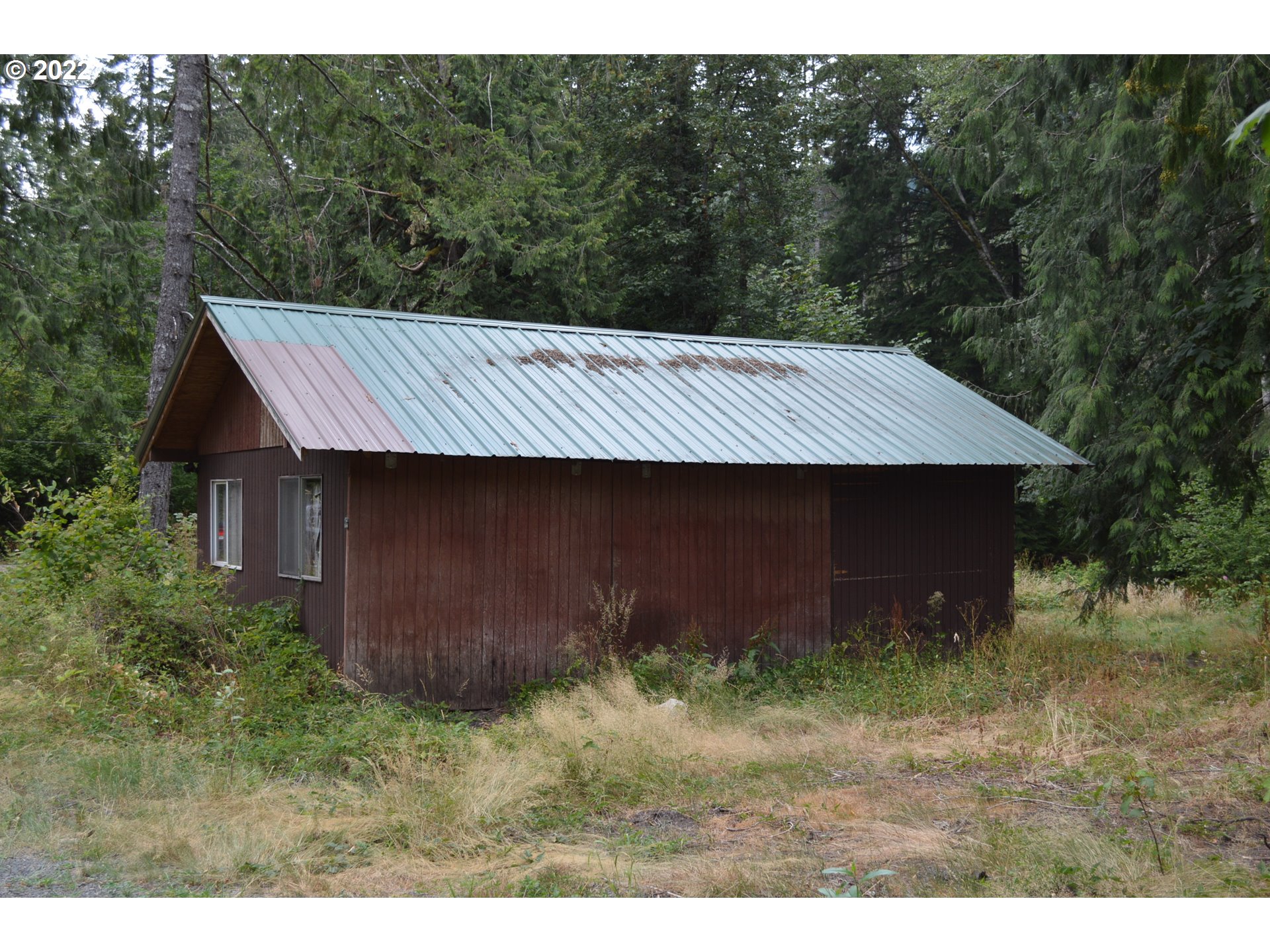 67193 East Barlow Trail Road Rhododendron, OR 97049 - Photo 11 of 19 a backyard of a house with lots of green space
