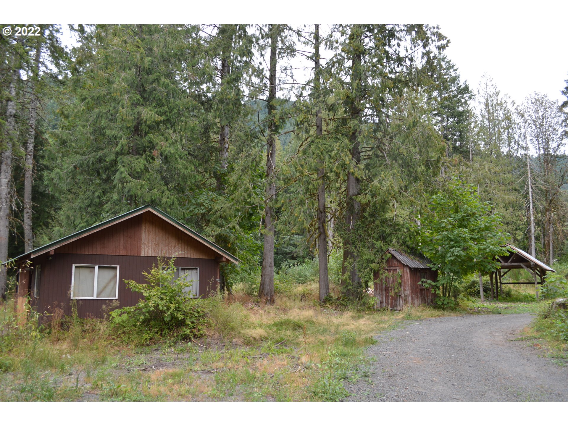 67193 East Barlow Trail Road Rhododendron, OR 97049 - Photo 13 of 19 a view of a house and yard