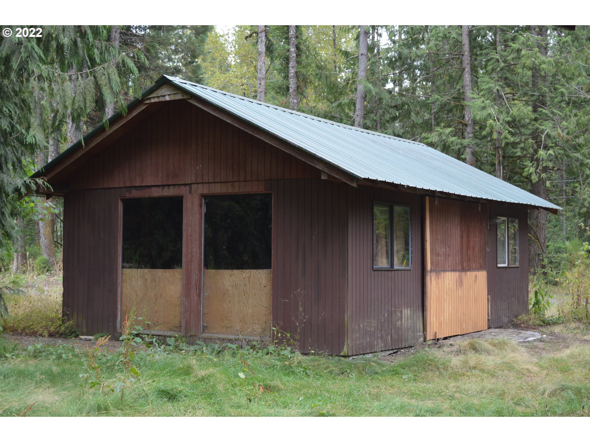 67193 East Barlow Trail Road Rhododendron, OR 97049 - Photo 9 of 19 a backyard of a house with lots of green space