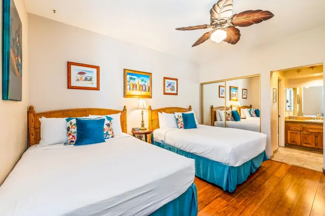 a bedroom with bed and wooden floor