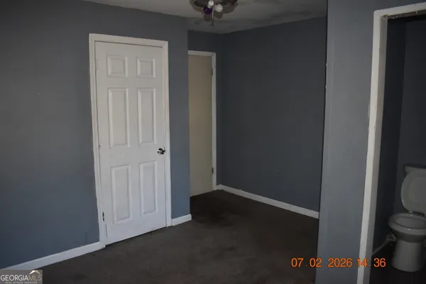 a view of an empty room and window
