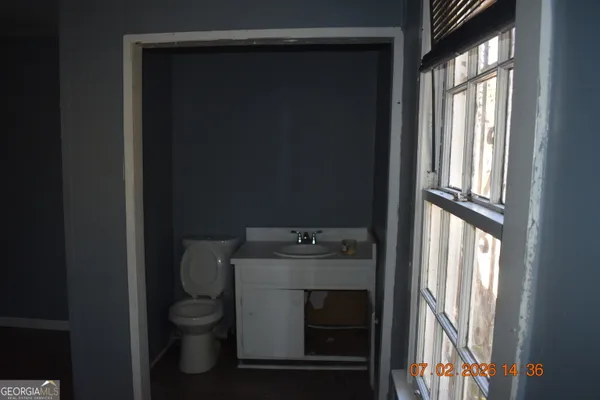 a view of a bathroom from a hallway