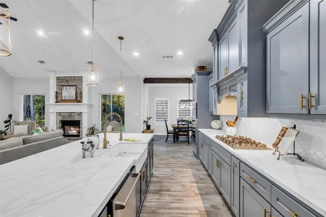 a large kitchen with a table and chairs