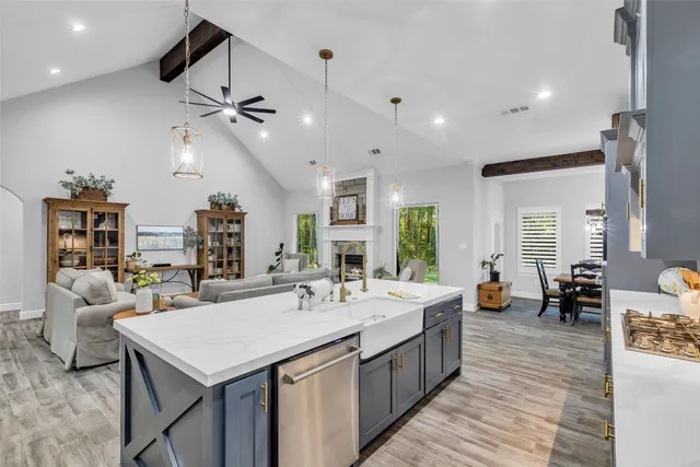 a view of a kitchen counter space a sink and living room view